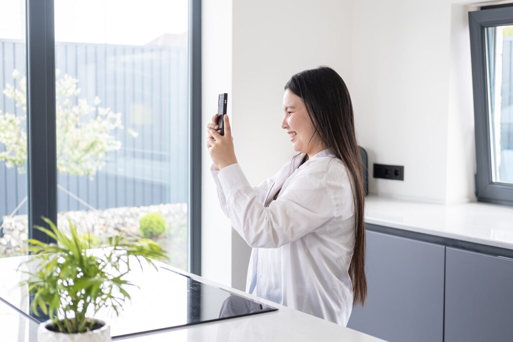 Real estate agent taking home photos for social media marketing